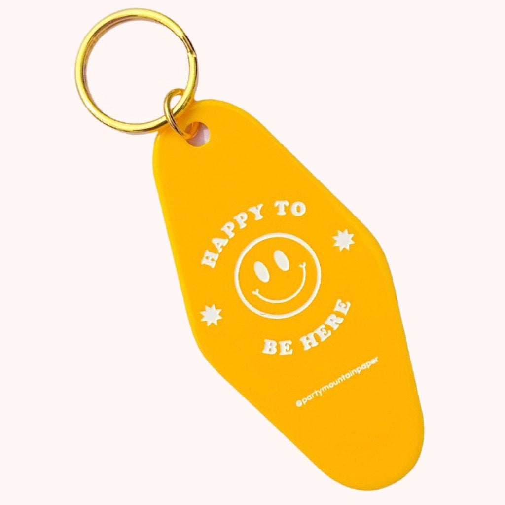 Happy To Be Here Motel Tag Keychain.
