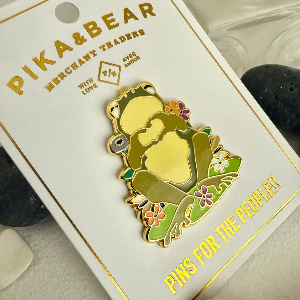 Heart Hands Frog Enamel Pin packaging.