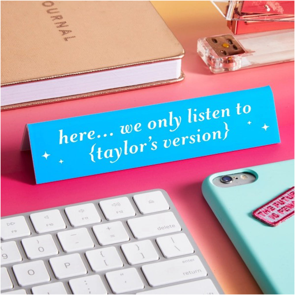 Here We Only Listen To Taylor's Version Desk Sign on table.