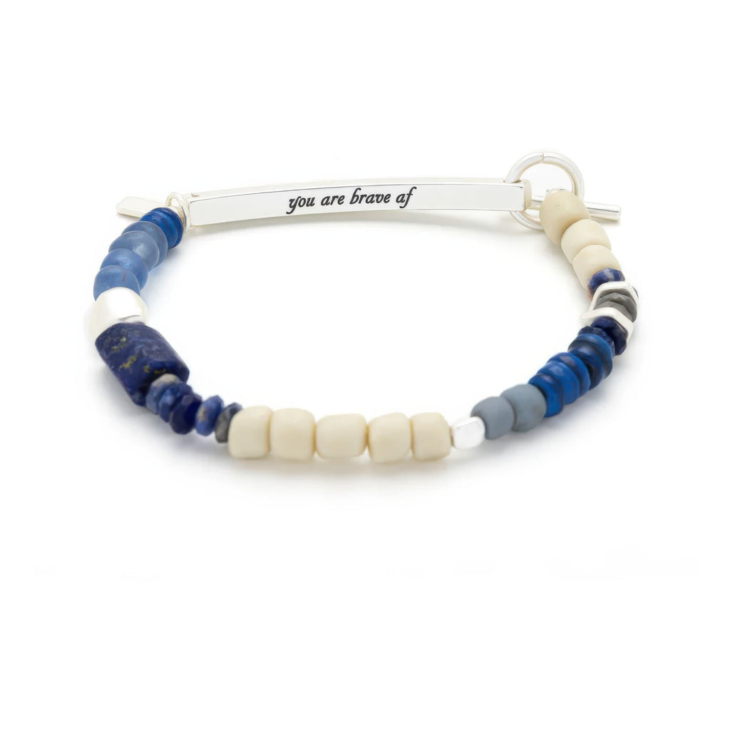 Hidden Message Bracelet Brave AF with metal tag.