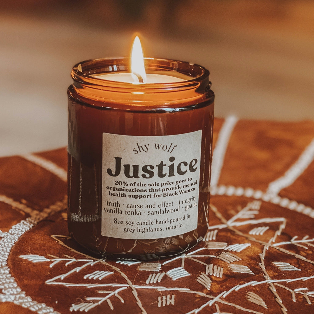 Justice Tarot Soy Wax Candle on cloth.