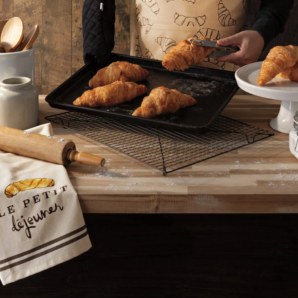 Le Petit Dejeuner Dishtowel on table.