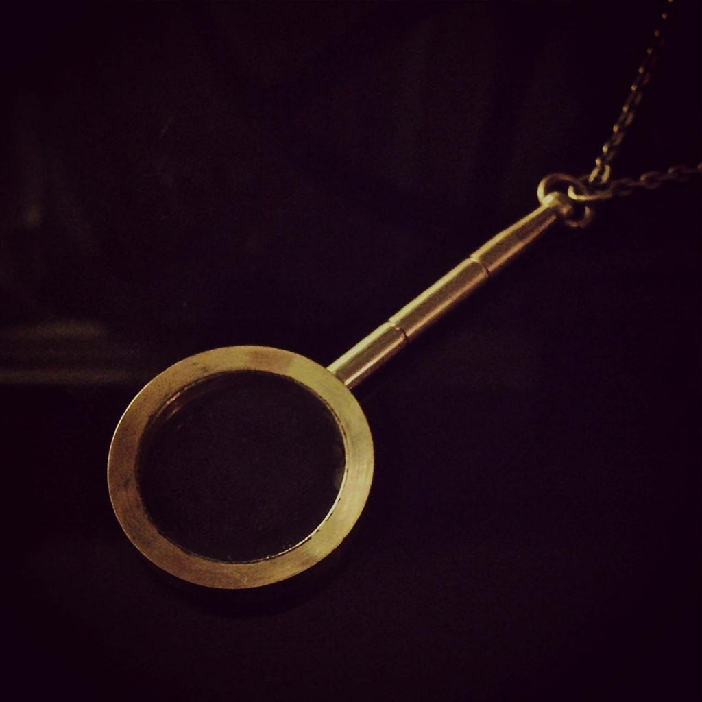 Magnifying Glass Necklace - black backgorund.