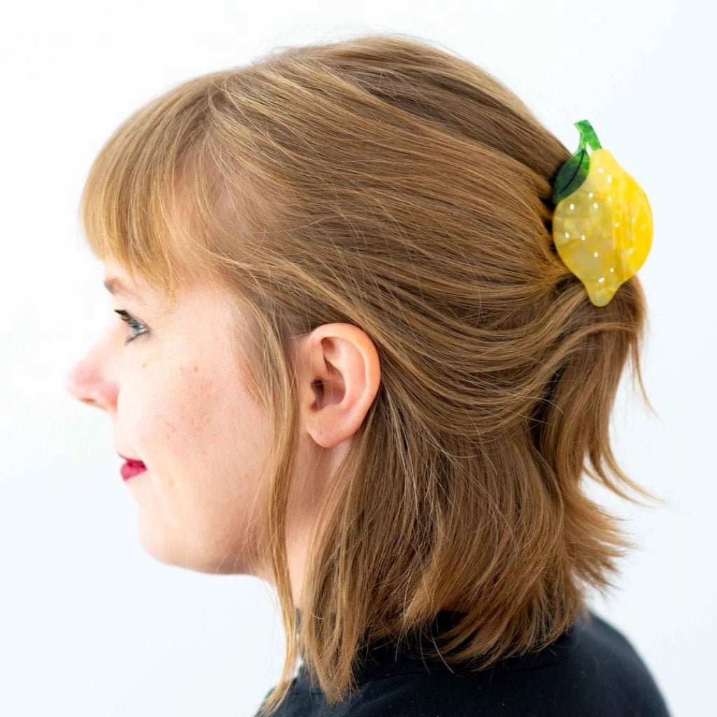 Midi Lemon Hair Claw in a person's hair.