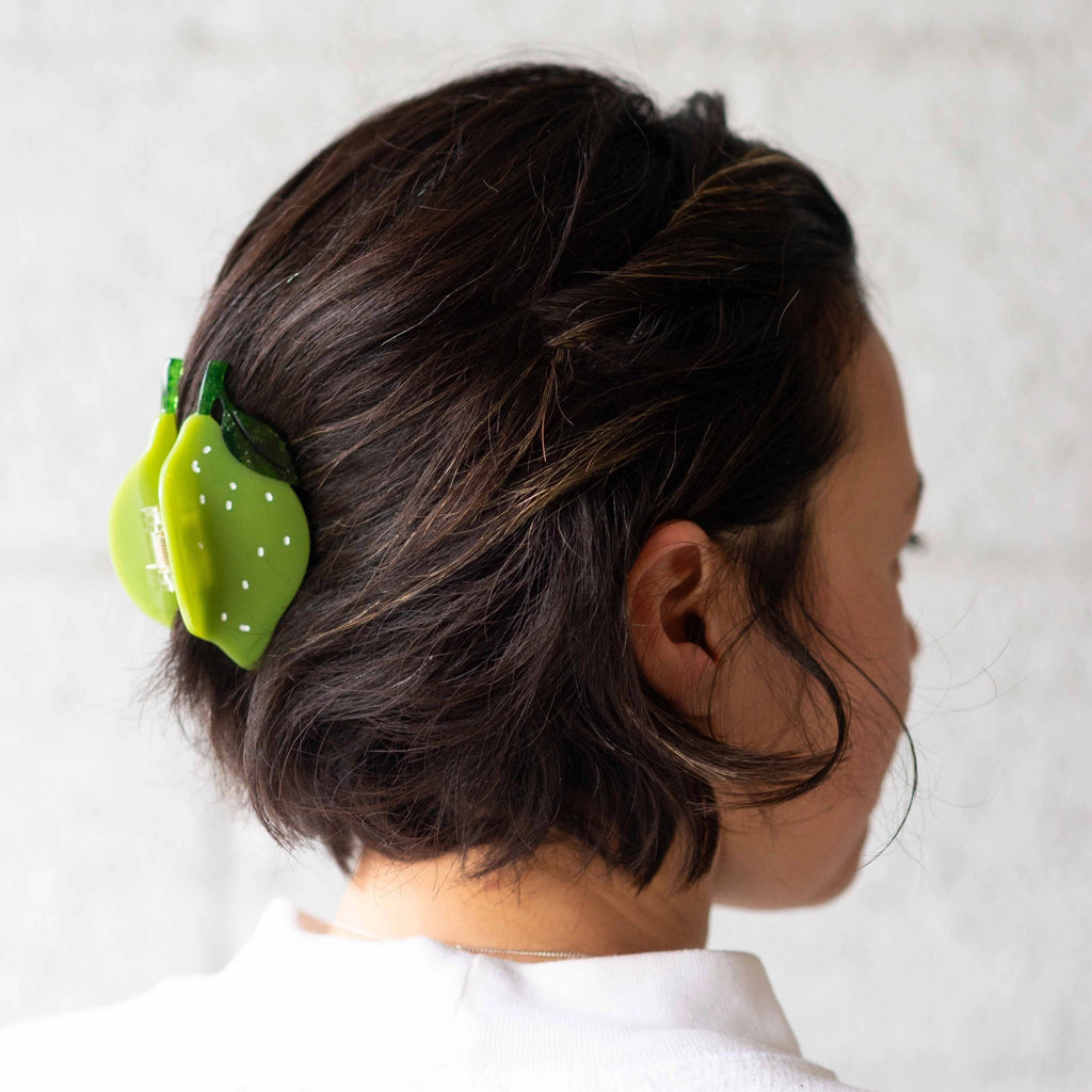 Midi Lime Hair Claw in persons hair.