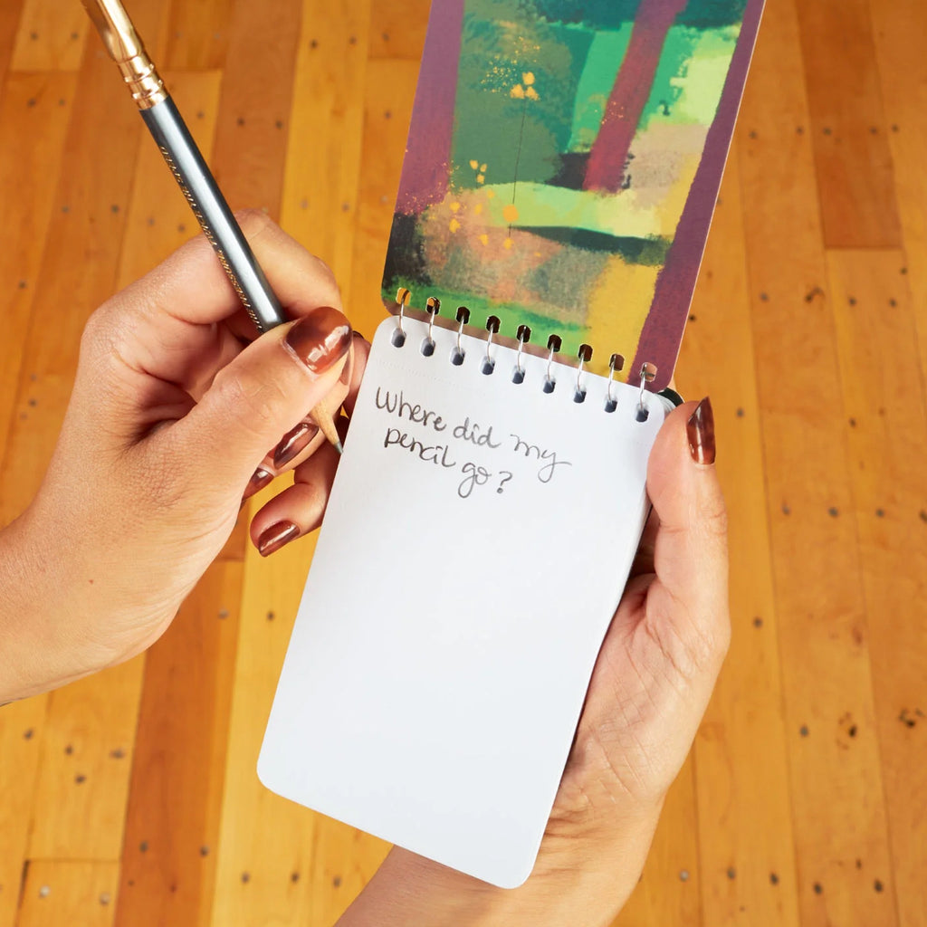 Mushroom Trip Spiral Notebook being used.