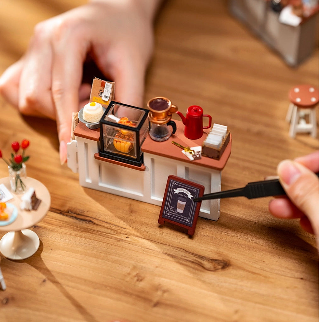 No. 17 Café DIY Miniature House Kit being assembled.