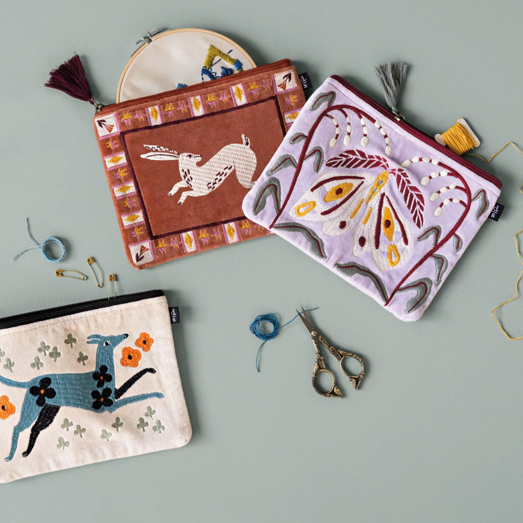 Nocturna Embroidered Flat Pouch on table.