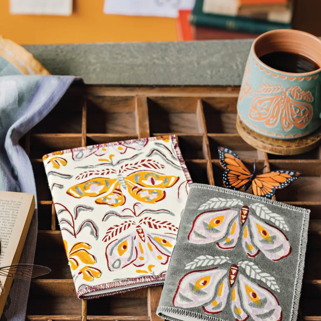 Nocturna Imprint Mug on table.