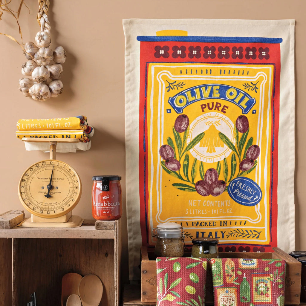 Olive Oil Dishtowel on wall.