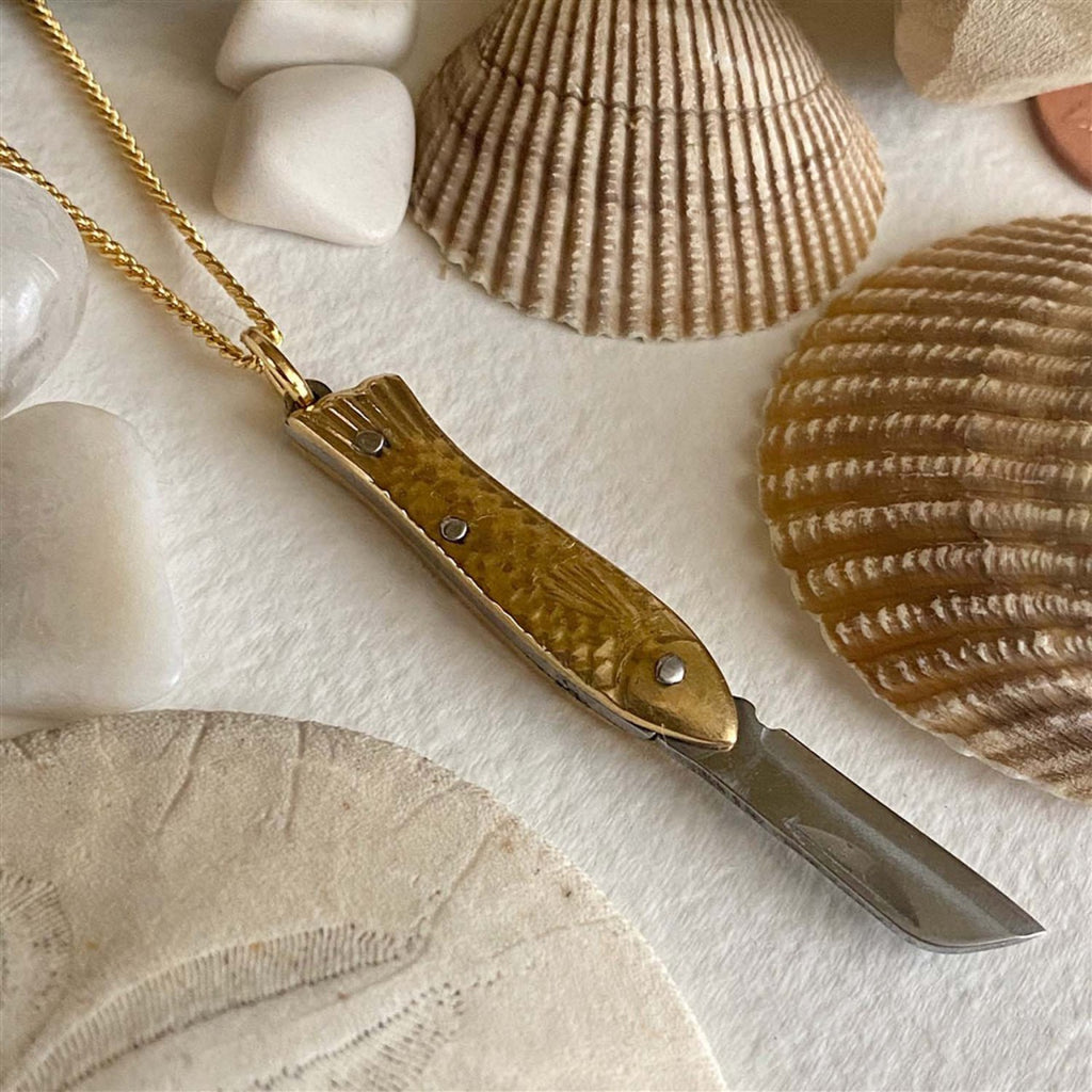 Open view of Fish Pocket Knife Charm Necklace.