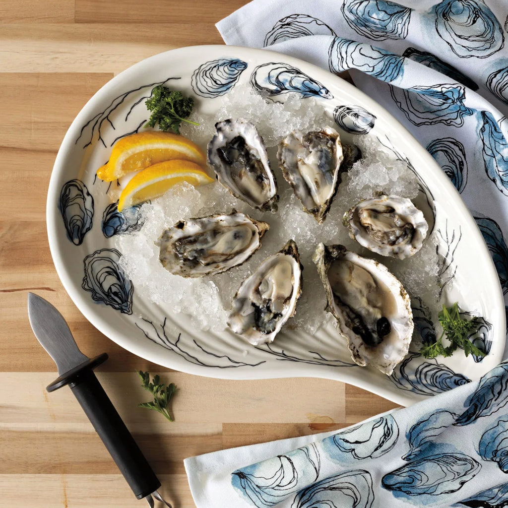 Oysters Printed Dishtowel on table.