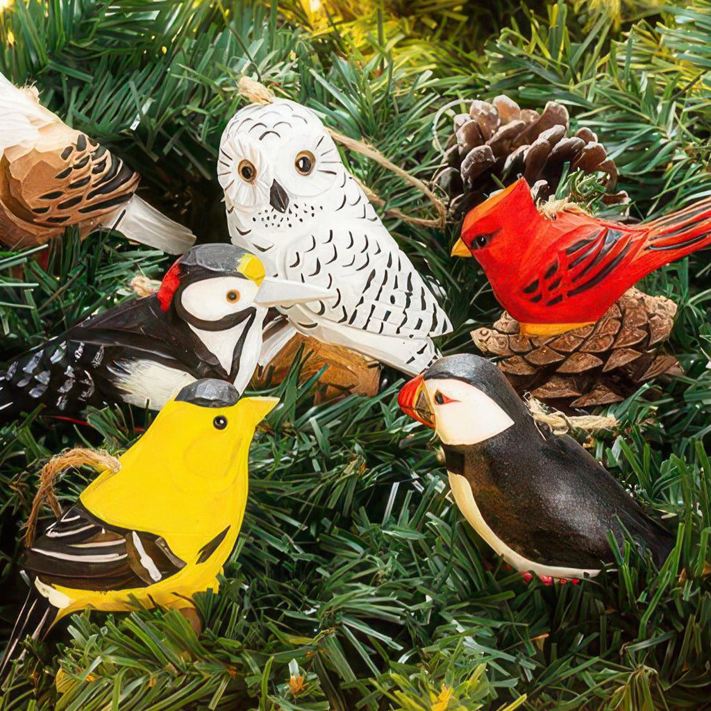 Perched Snowy Owl Carved Ornament in tree.