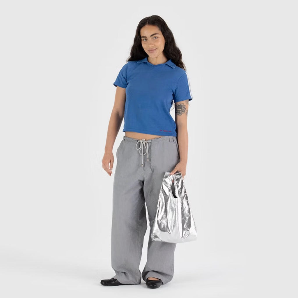 Person holding Baby Baggu Metallic Silver.