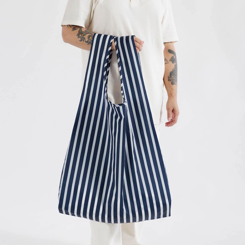 Person holding Big Baggu Navy Stripe.