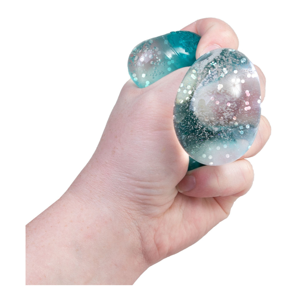 Person holding Groovy Jewel Needoh.