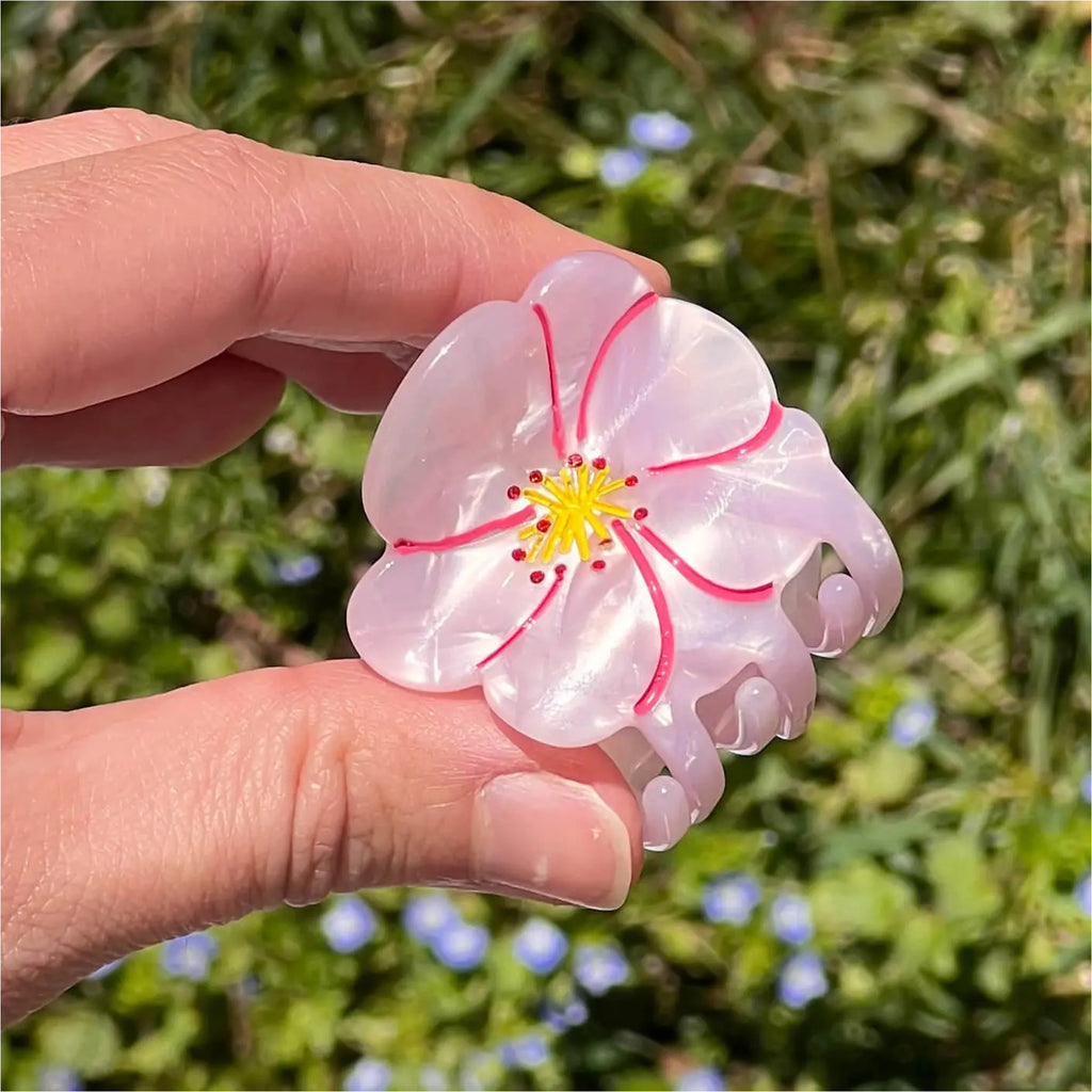 Person holding Mini Cherry Blossom Hair Claw.