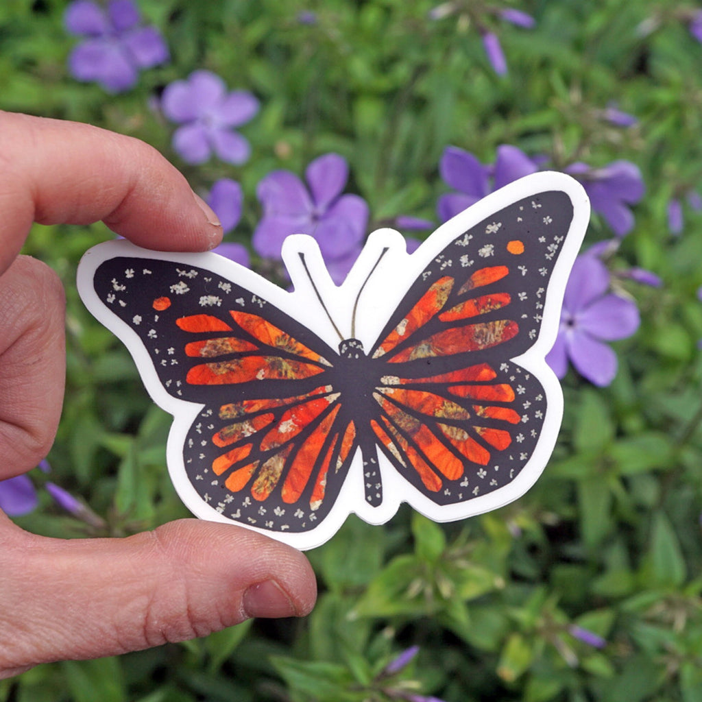 Person holding Monarch Butterfly Floral Sticker.