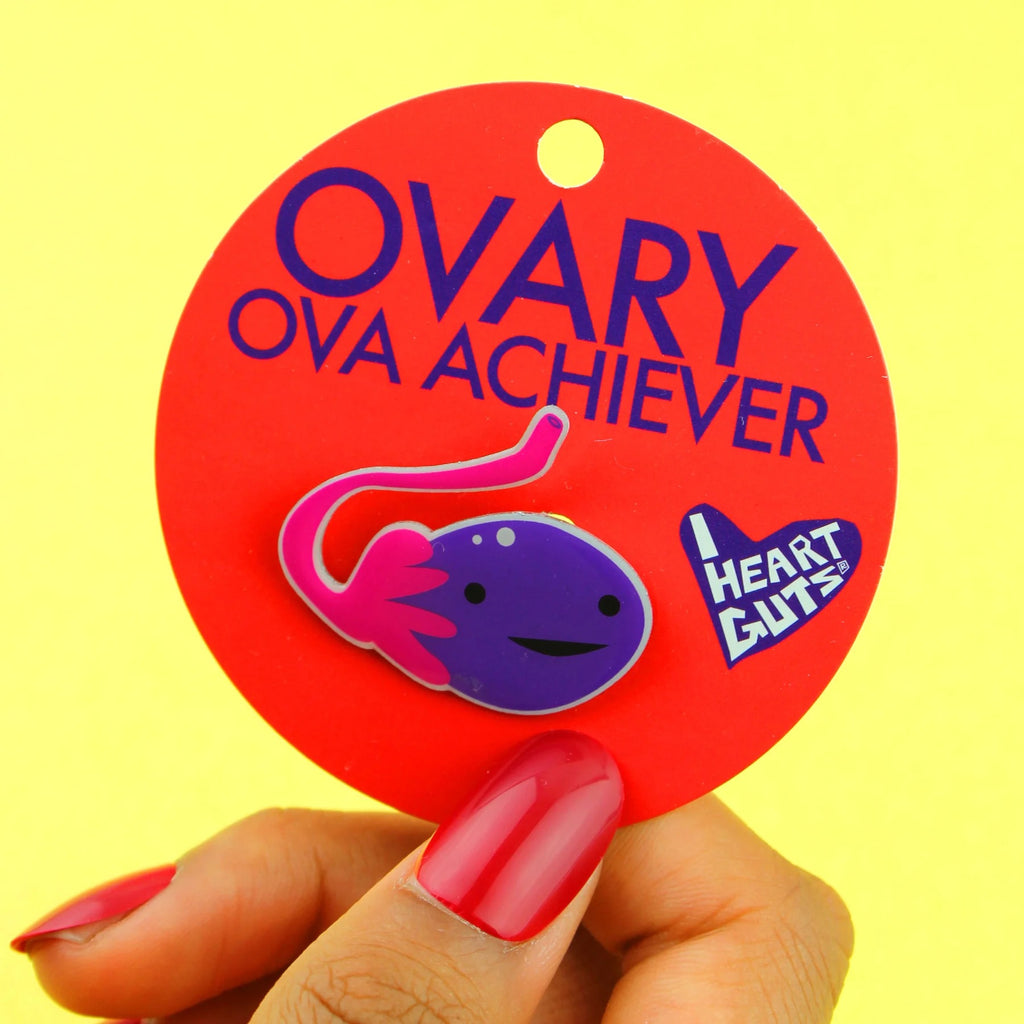 Person holding Ovary Lapel Pin.