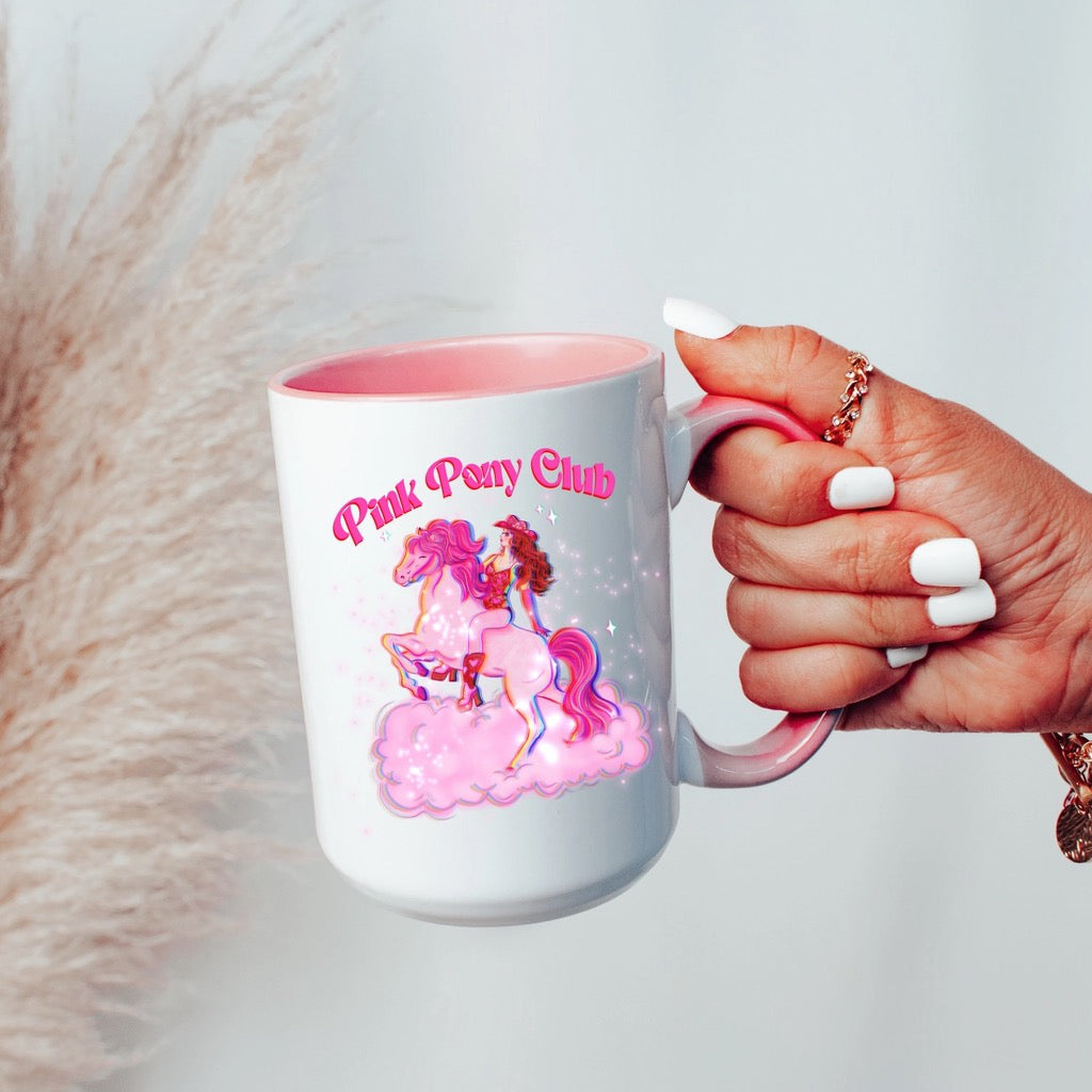 Person holding Pink Pony Club Mug with Pink Handle.