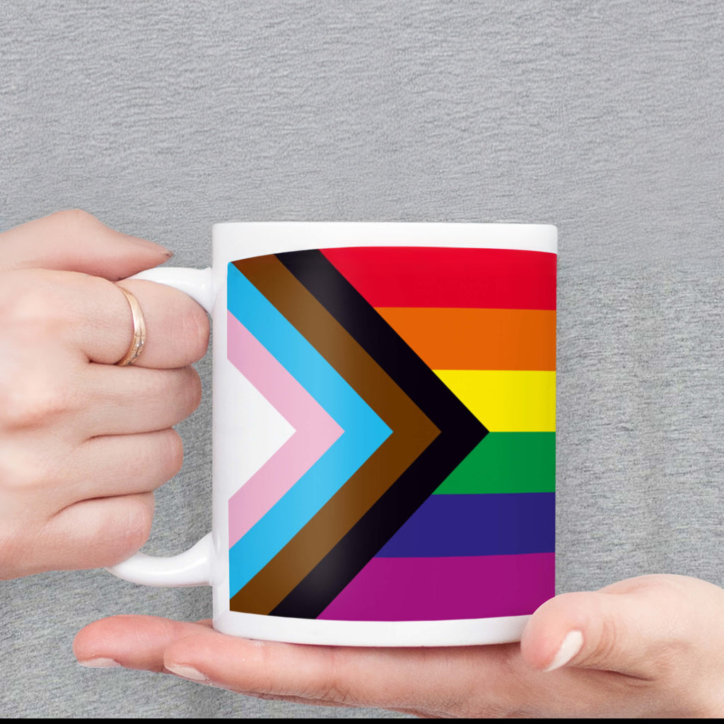 Person holding Progress Pride Flag Mug.