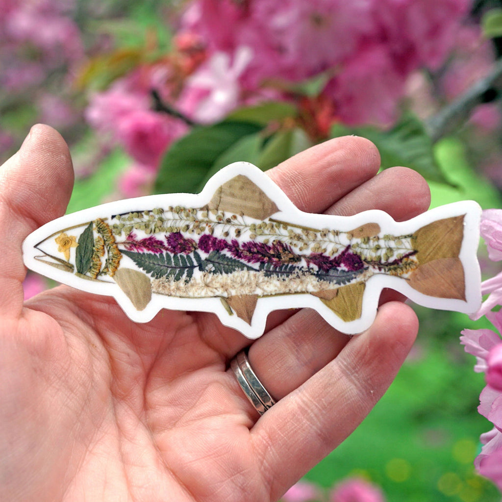 Person holding Rainbow Trout Floral Sticker.