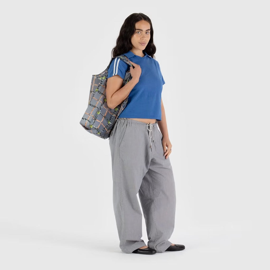 Person holding Standard Baggu Beaded Plaid.