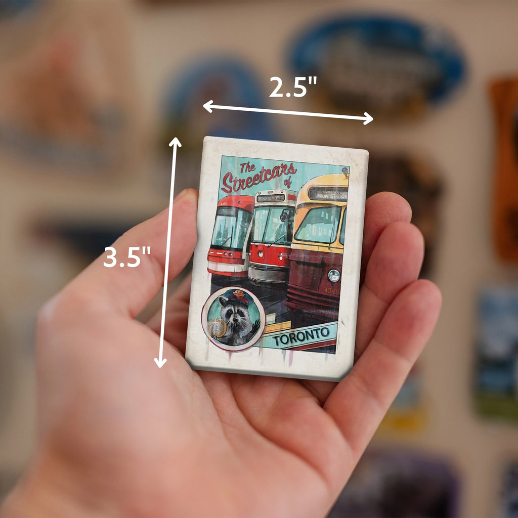 Person holding Streetcars of Toronto Fridge Magnet.