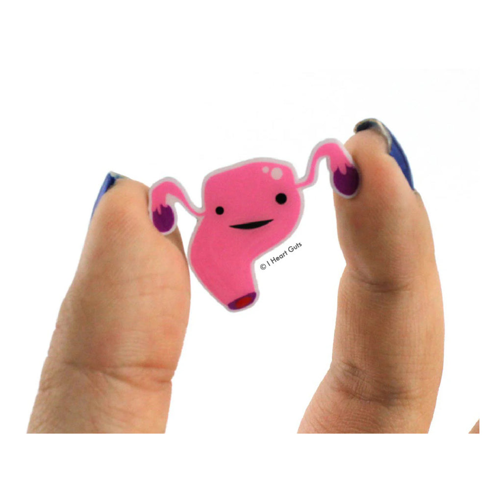 Person holding Uterus Lapel Pin.