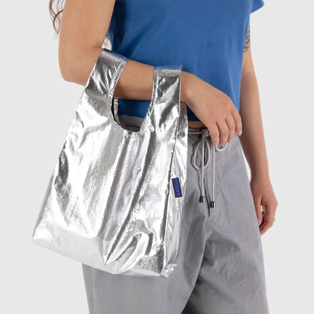 Person using Baby Baggu Metallic Silver.