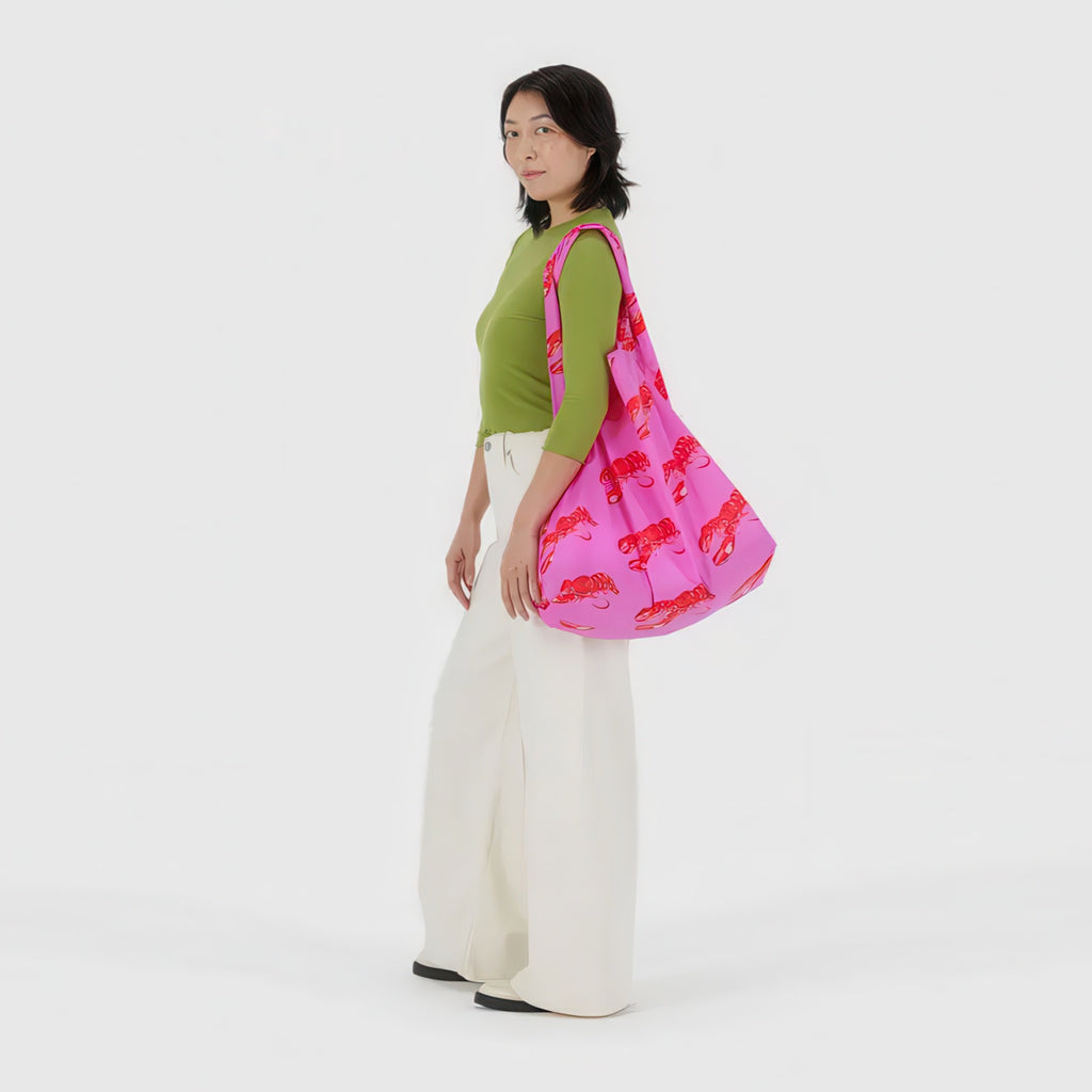 Person using Big Baggu Pink Lobster.