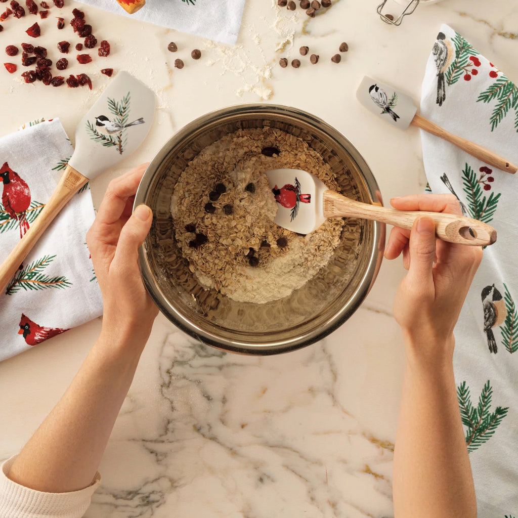 Person using Birds & Boughs Christmas Mini Silicone Spatula.
