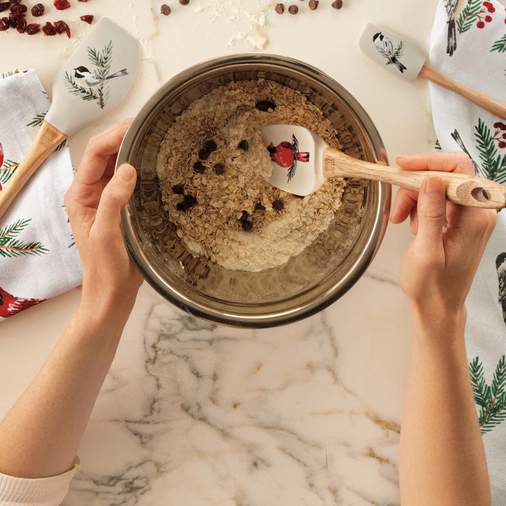 Person using Birds & Boughs Christmas Silicone Spoonula.