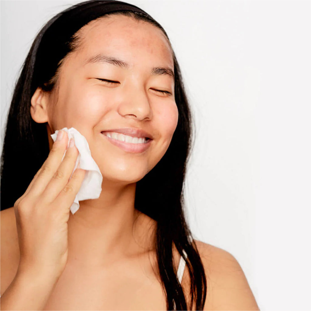 Person using Clean AF Facial Cleansing Wipes.