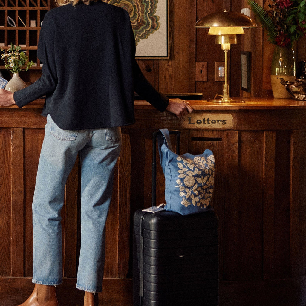 Person using English Rose Canvas Tote Bag.