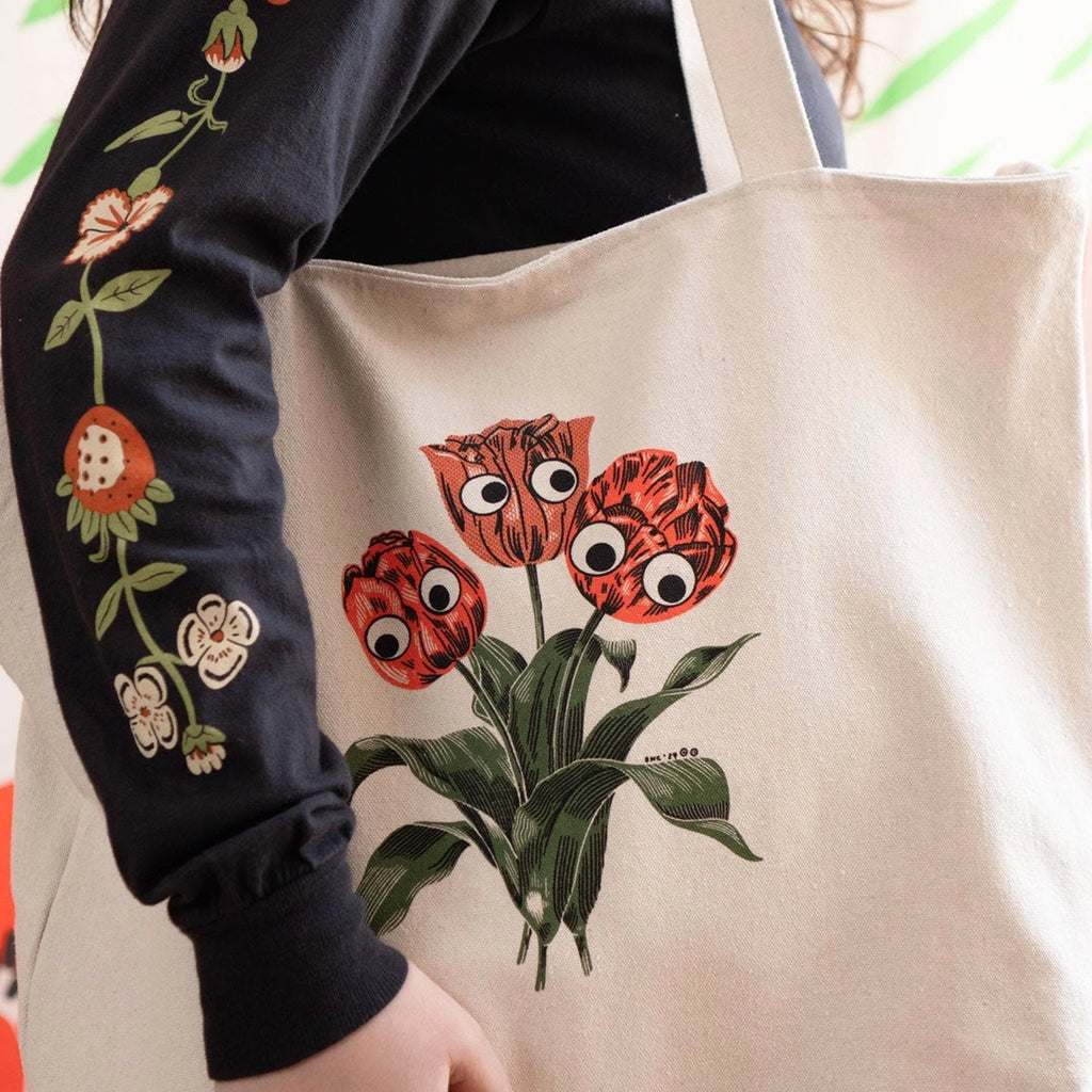 Person using Googly Tulips Zip Tote.