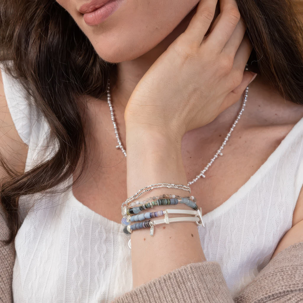 Person using Hidden Message Bracelet Strong.
