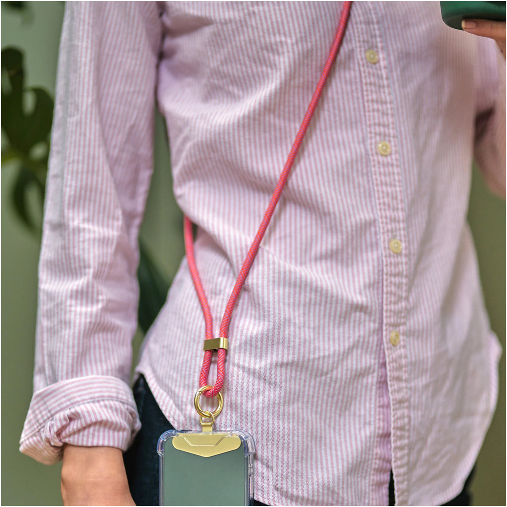 Person using Inkerie Charge & Carry Phone Lanyard Pink.