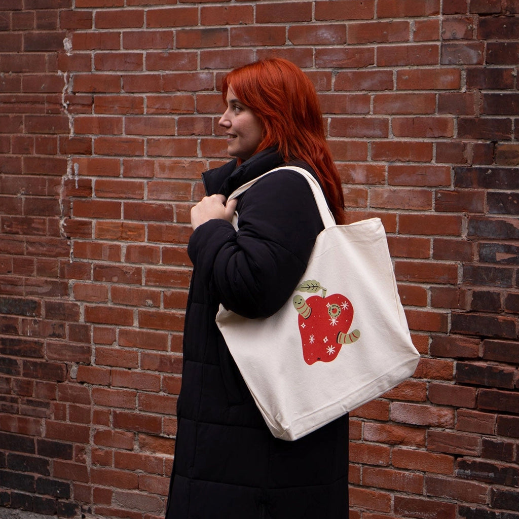 Person using Rotten Apple Zip Tote.