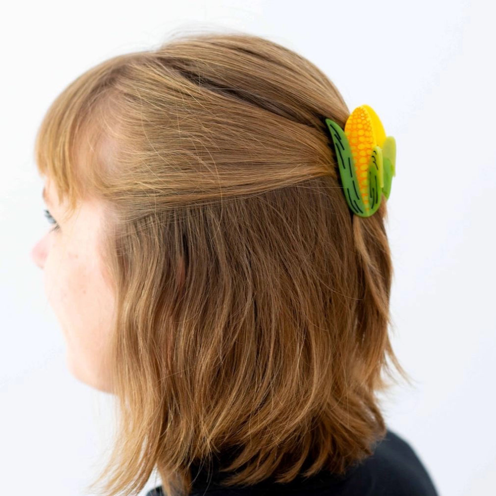 Person wearing Baby Corn Hair Claw.