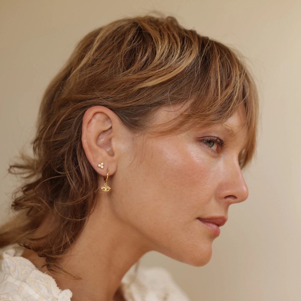 Person wearing Crystal Triangle Stud Earring.