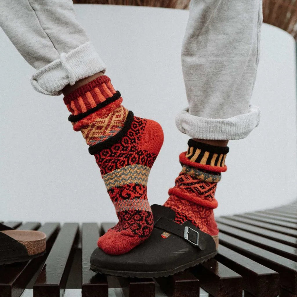 Person wearing Fire Mismatched Crew Socks.