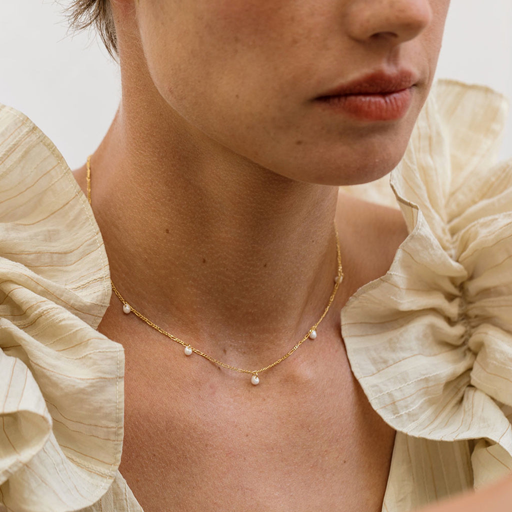 Person wearing Five Graces Pearl Necklace.