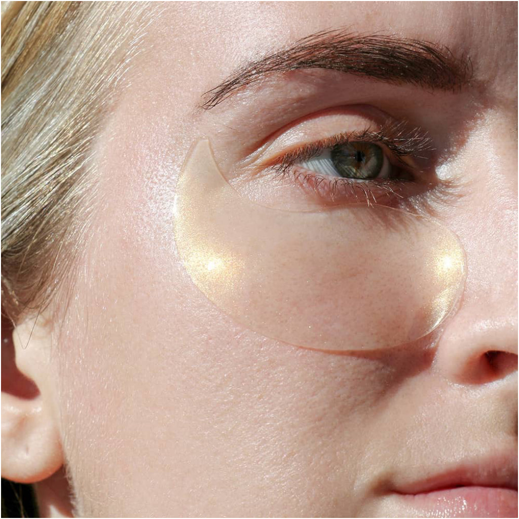 Person wearing FlashPatch Illuminating Eye Gels 5 Pack.