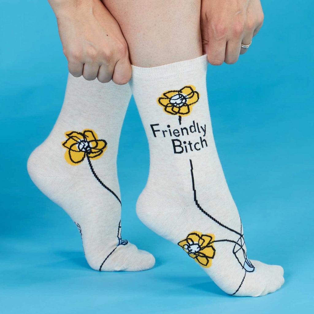 Person wearing Friendly Bitch Crew Socks.