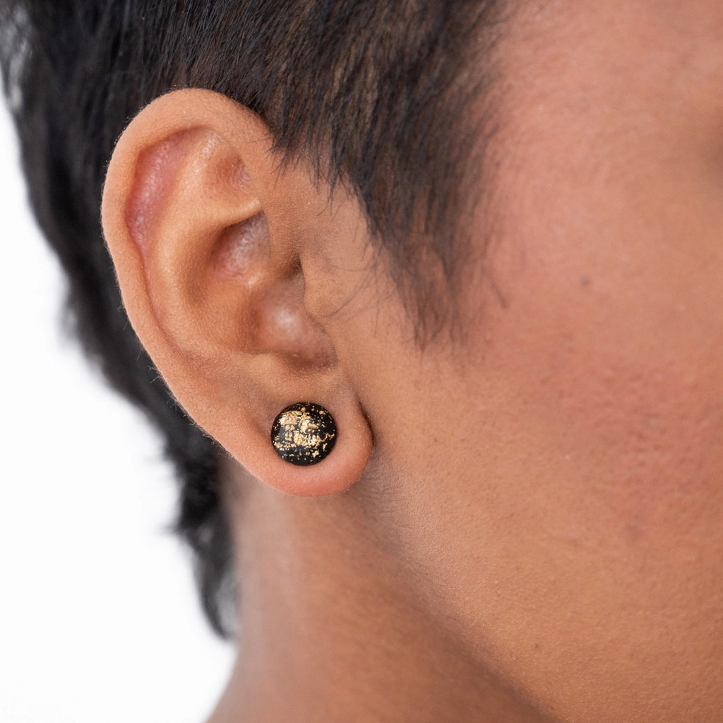 Person wearing Gold Flake Disc Earrings Black.