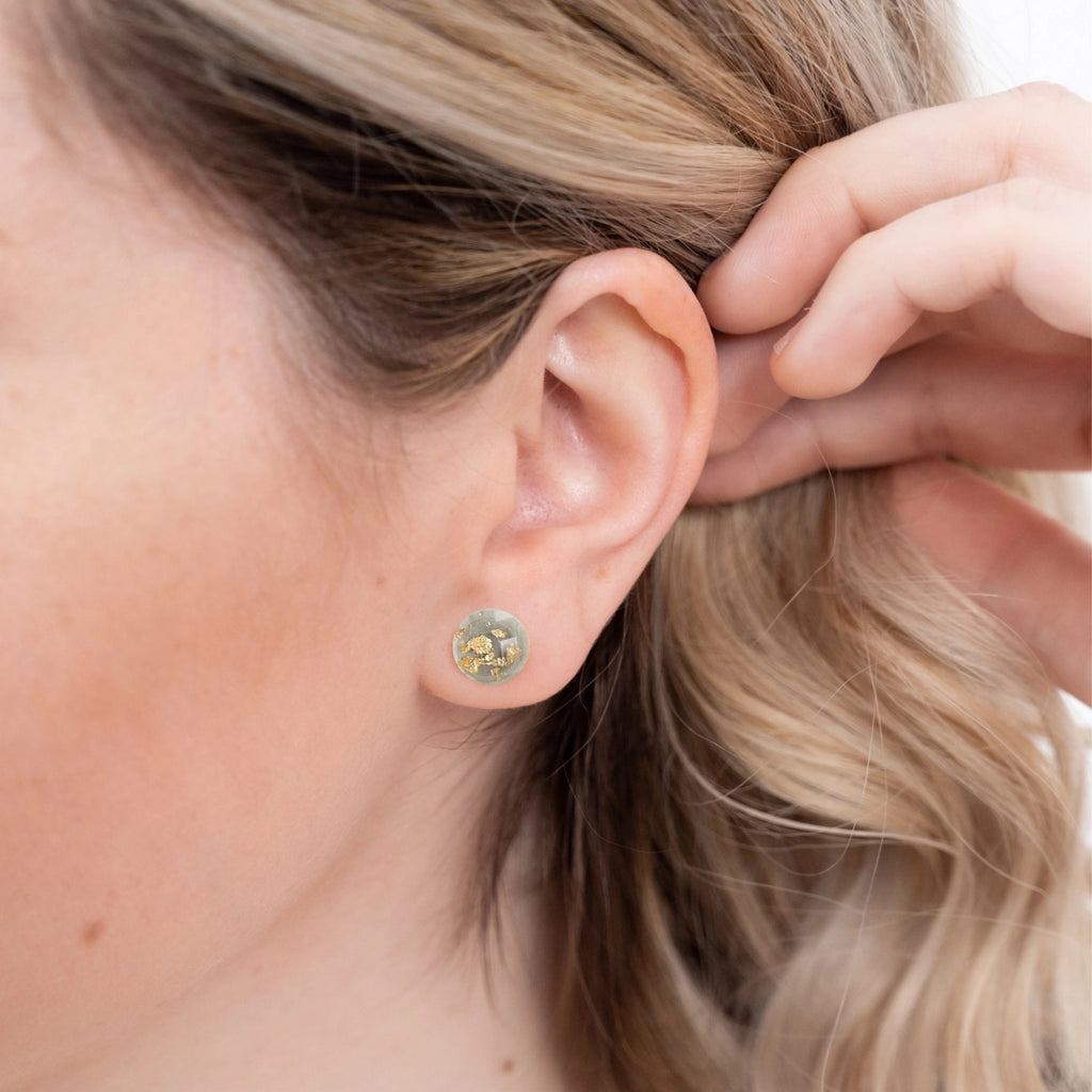 Person wearing Gold Flake Disc Earrings Grey.