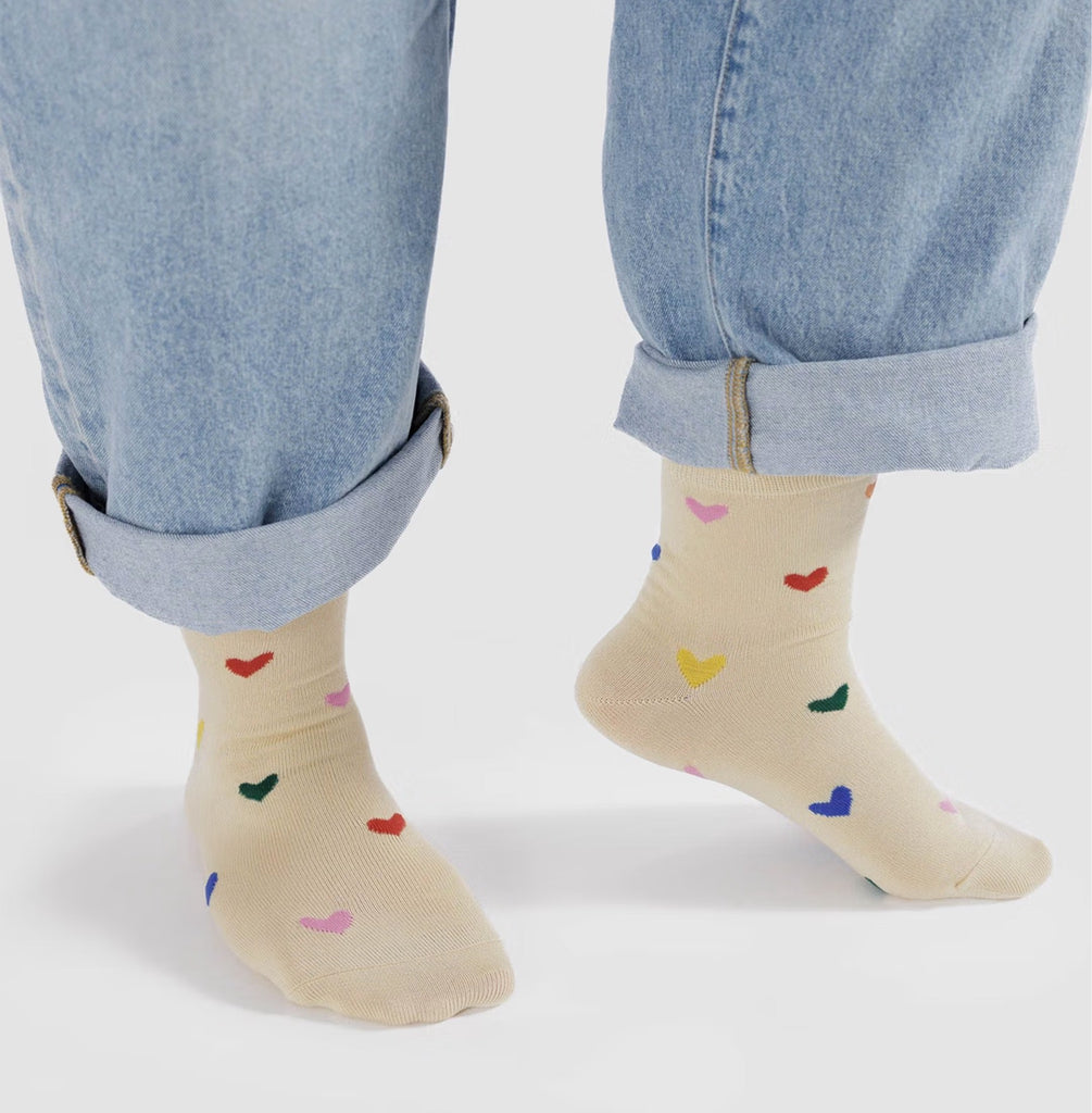 Person wearing Hearts Crew Socks.