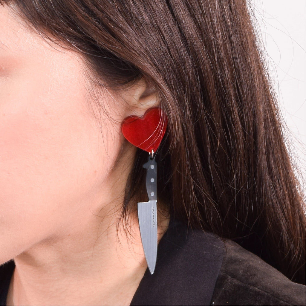 Person wearing I Heart Knives Earrings Red.