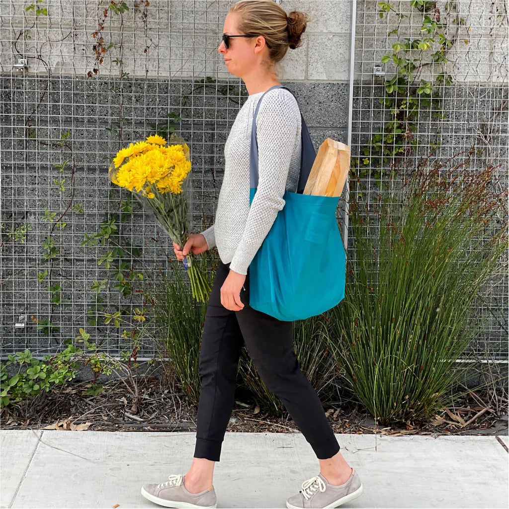Person wearing Maroon 24-7 Bag.